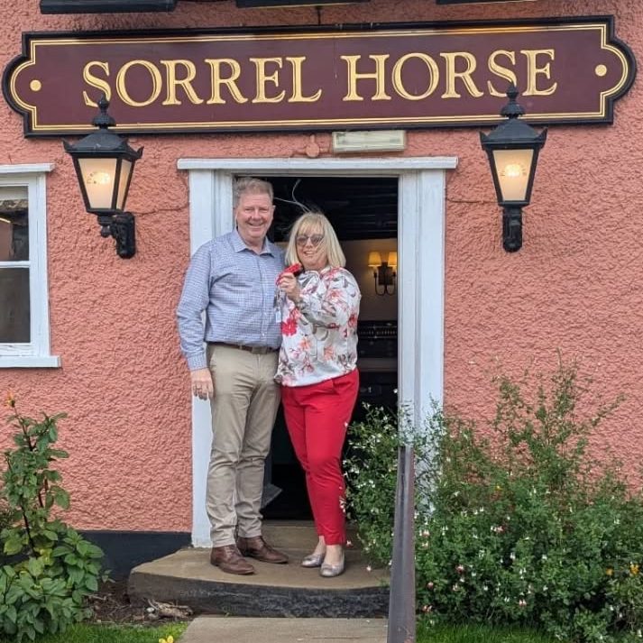 Tony and Michelle Power standing outside the front of The Sorrel Horse Inn, Shottisham, Suffolk.